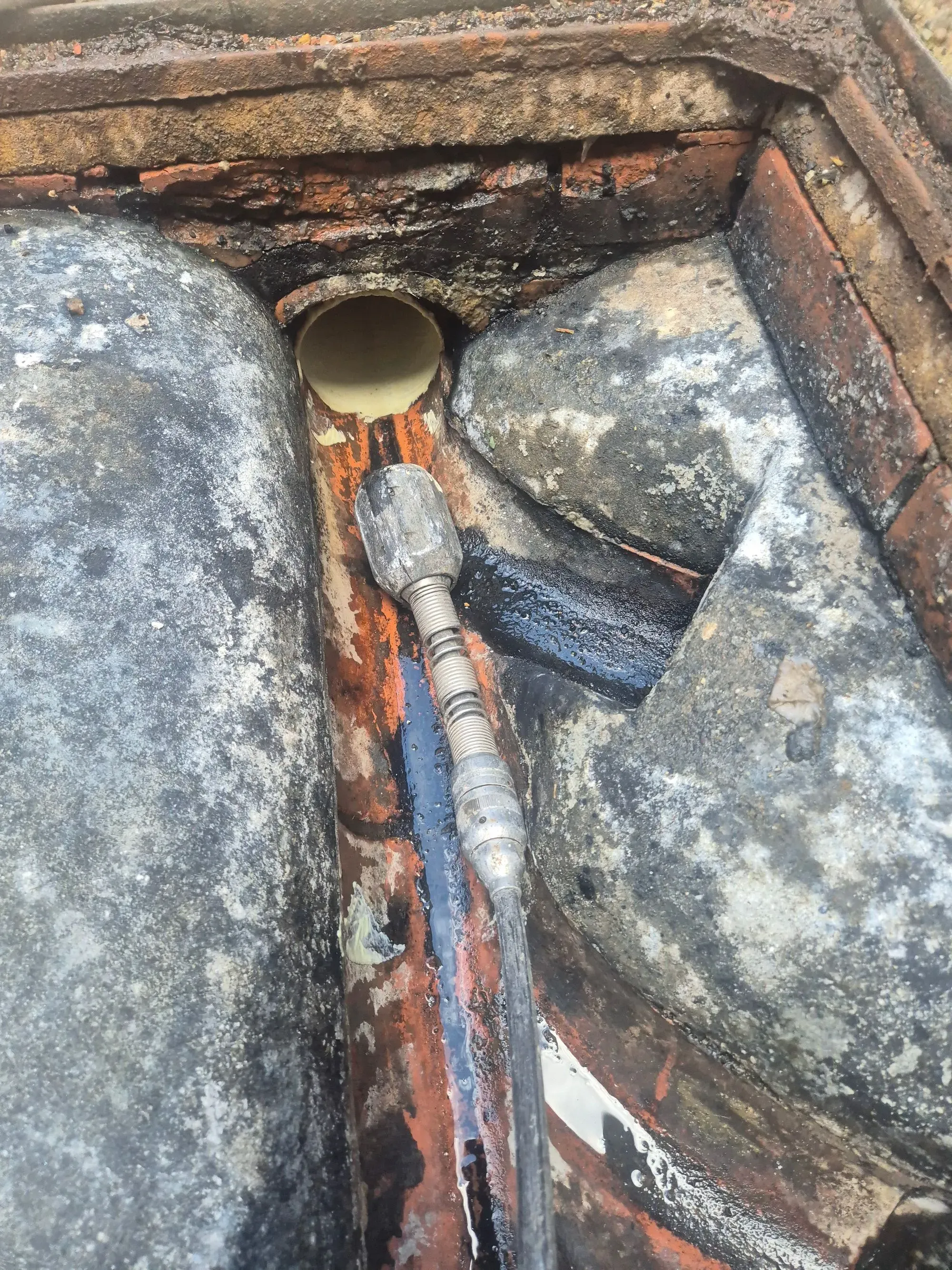 Drainage specialist clearing a blocked drain in Royston
